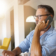 Home-office businessman talking on phone
