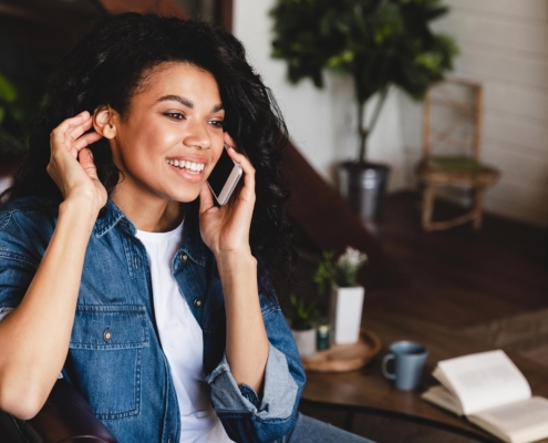 Satisfied person on phone call with customer support